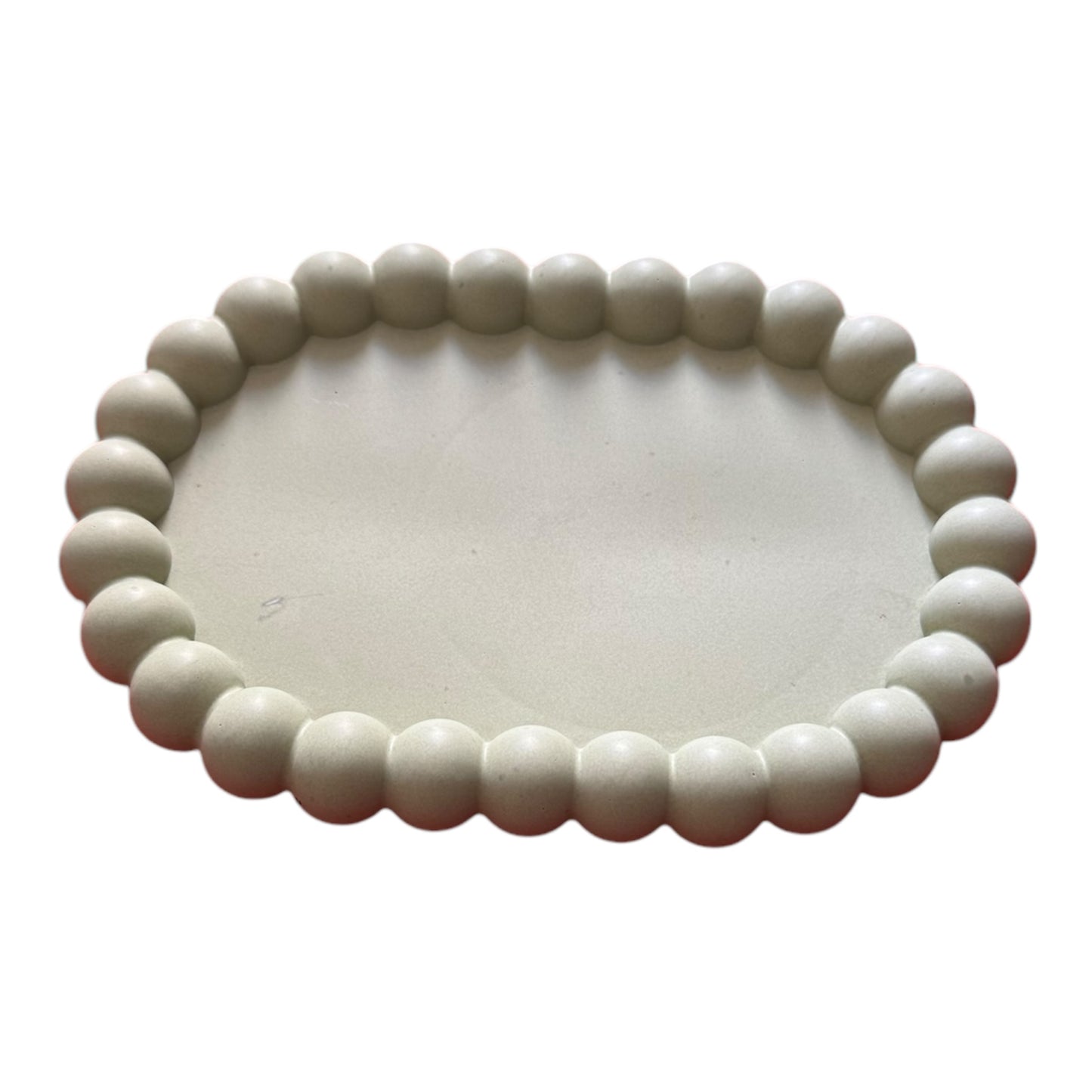 Sage green bubble tray made from eco-friendly jesmonite