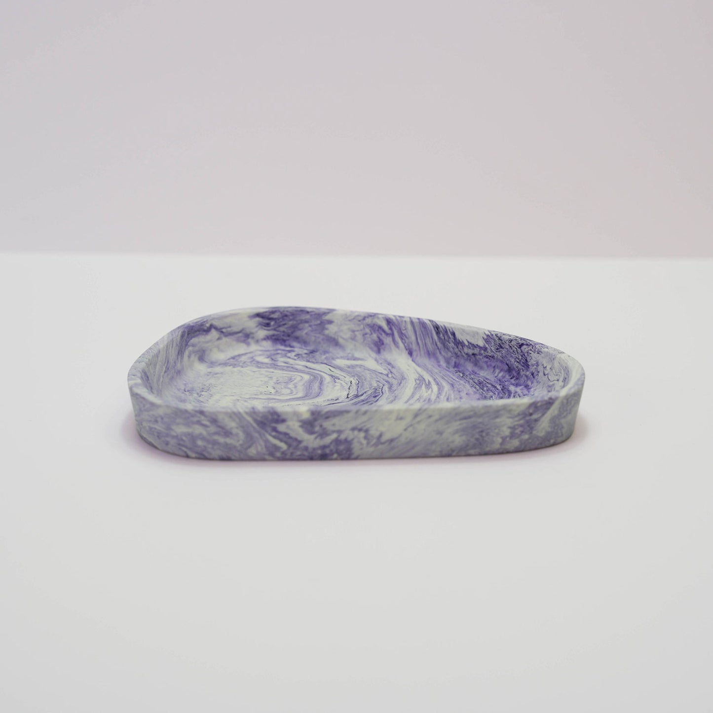 A jesmonite trinket tray in purple