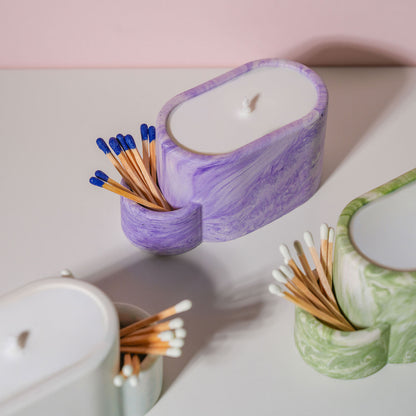 Jesmonite candle pots with match holder in a range of different colours.