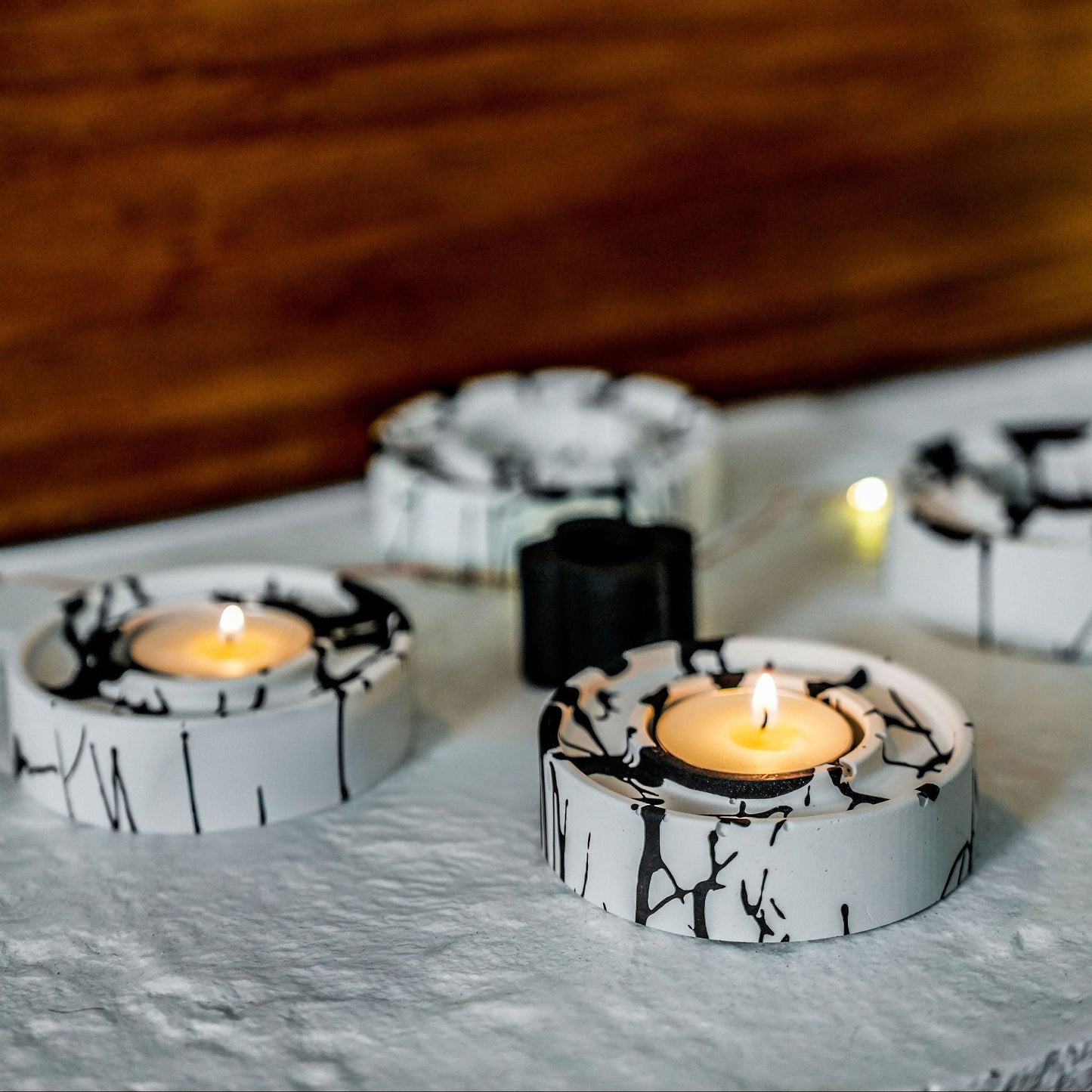 jesmonite tea light holders in black and white