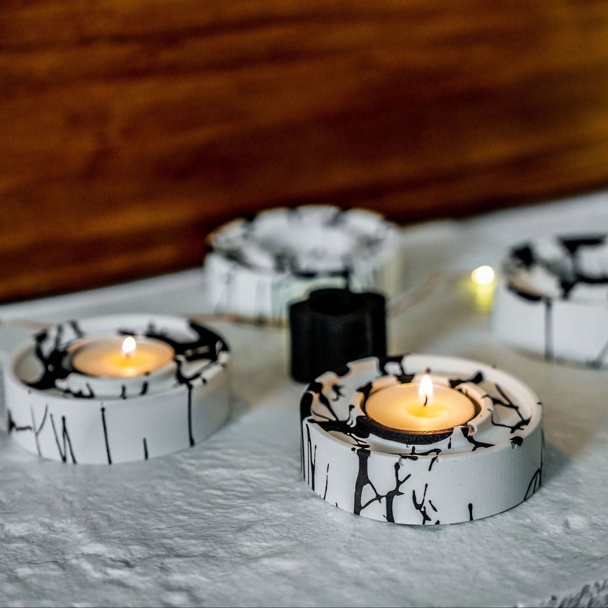 jesmonite tea light holders in black and white