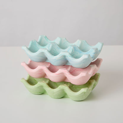 A selection of jesmonite egg trays in various colors