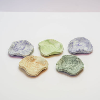 A selection of small Jesmonite jewellery mini trays in a range of colours
