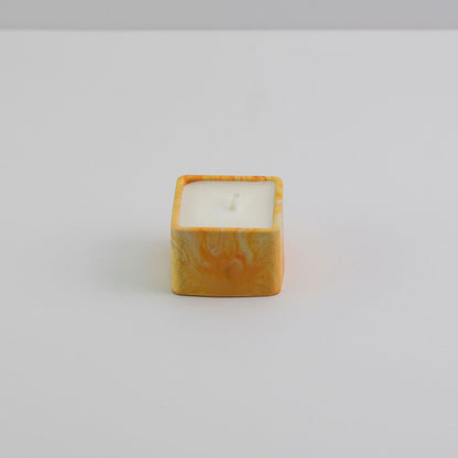  A small square jesmonite candle holder in orange