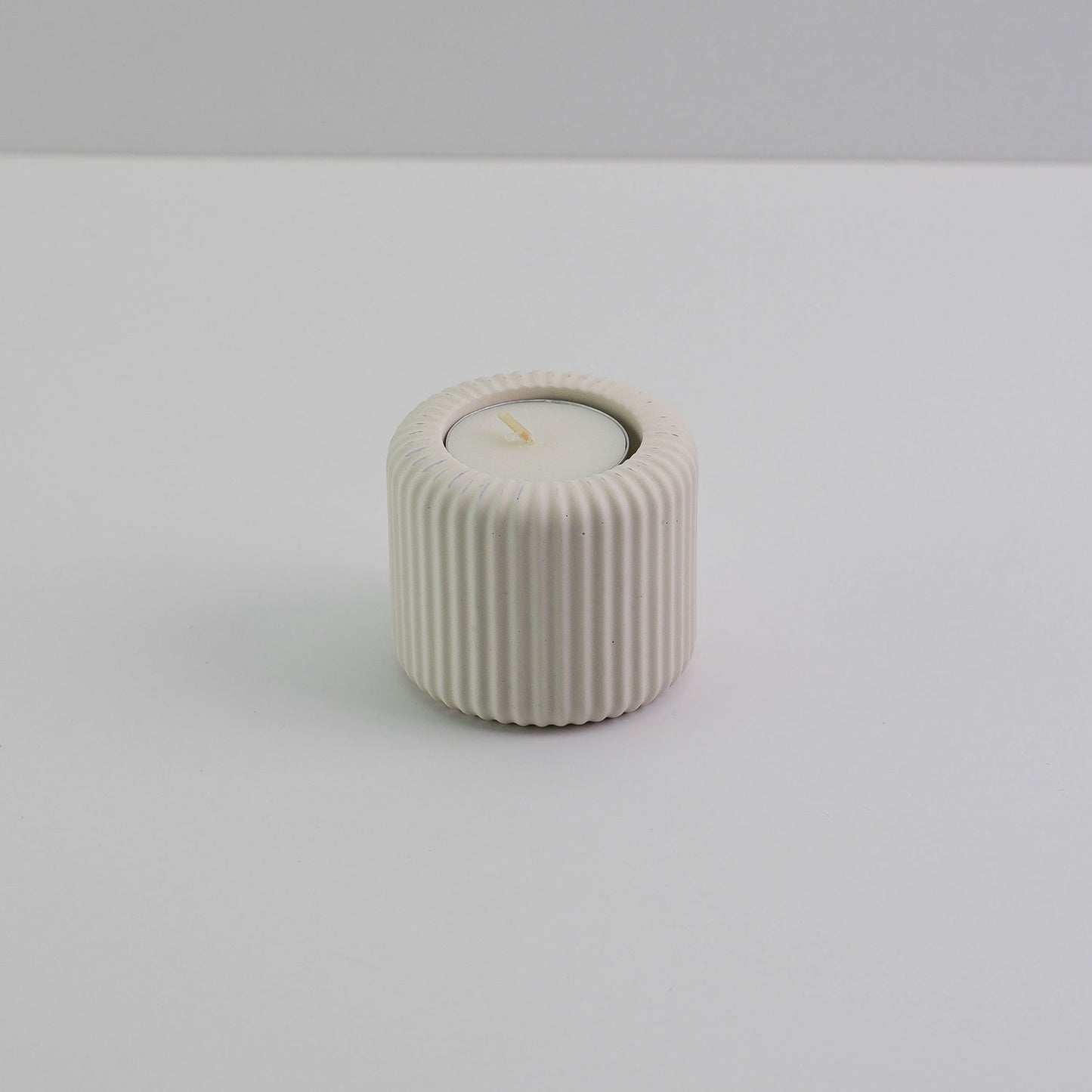 Jesmonite ridged tea light holder in cream