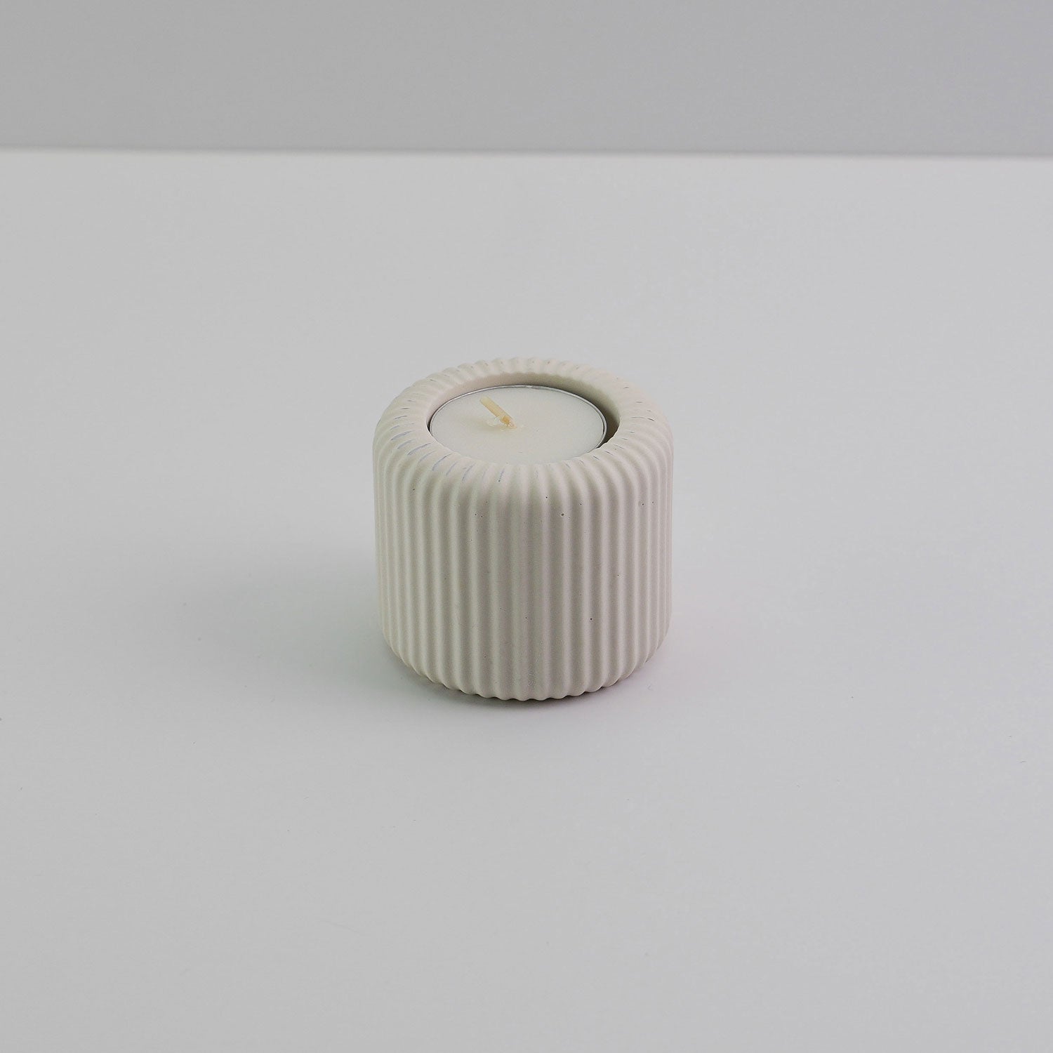 Jesmonite ridged tea light holder in cream