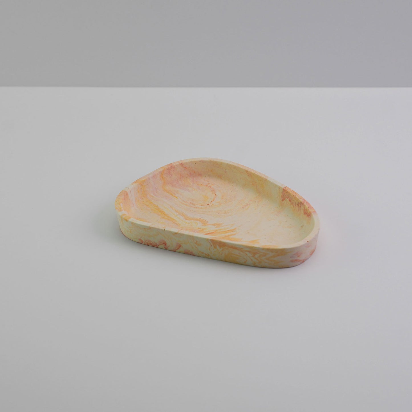 Jesmonite trinket tray in orange.