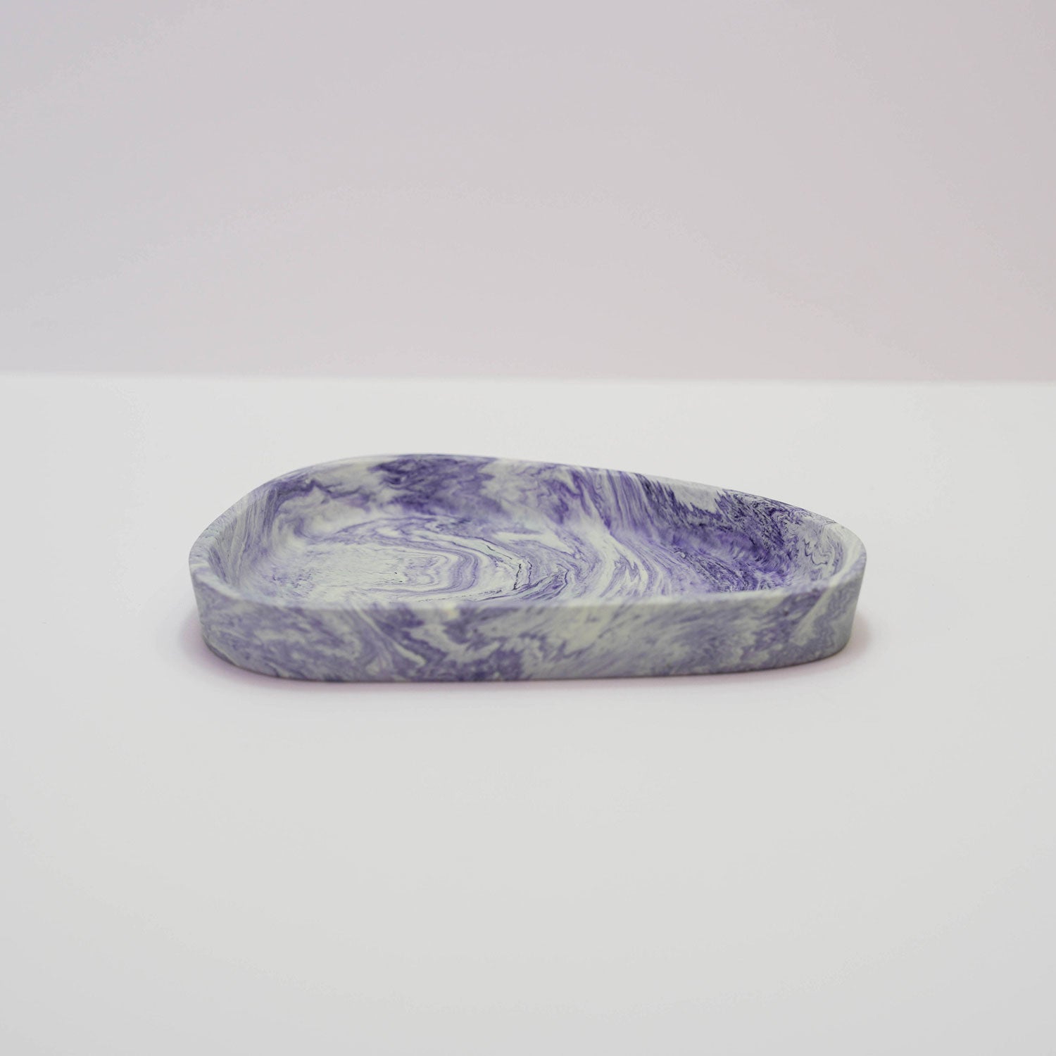 A jesmonite trinket tray in purple